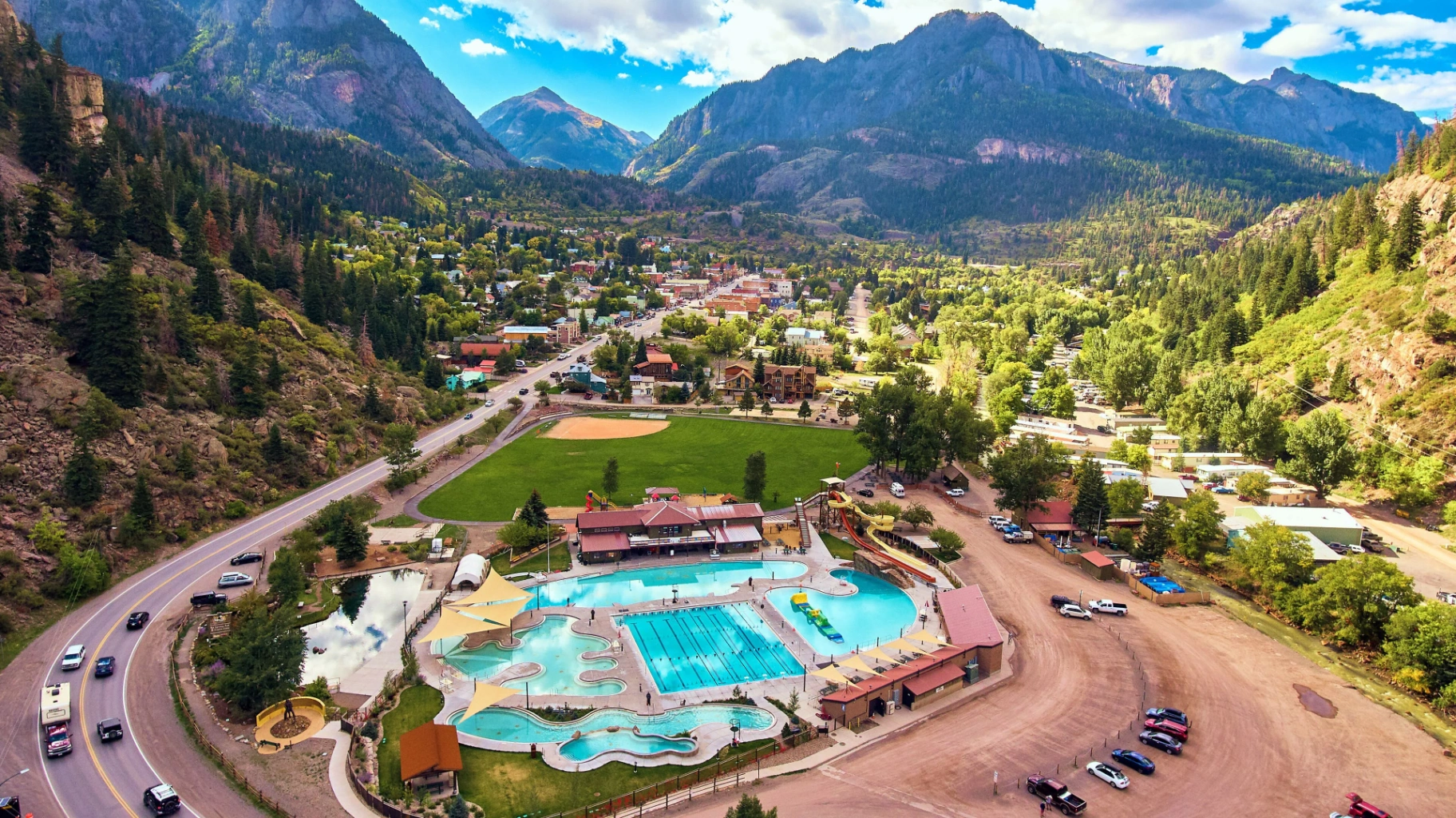 Aerial view of Ouray, Colorado hot springs pool nestled in the San Juan Mountains box canyon