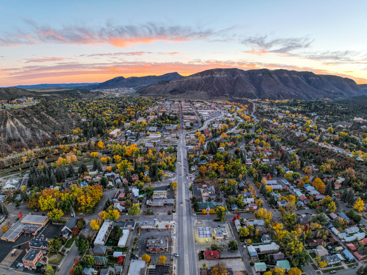 Sunset aerial of Durango neighborhoods and surrounding mesas