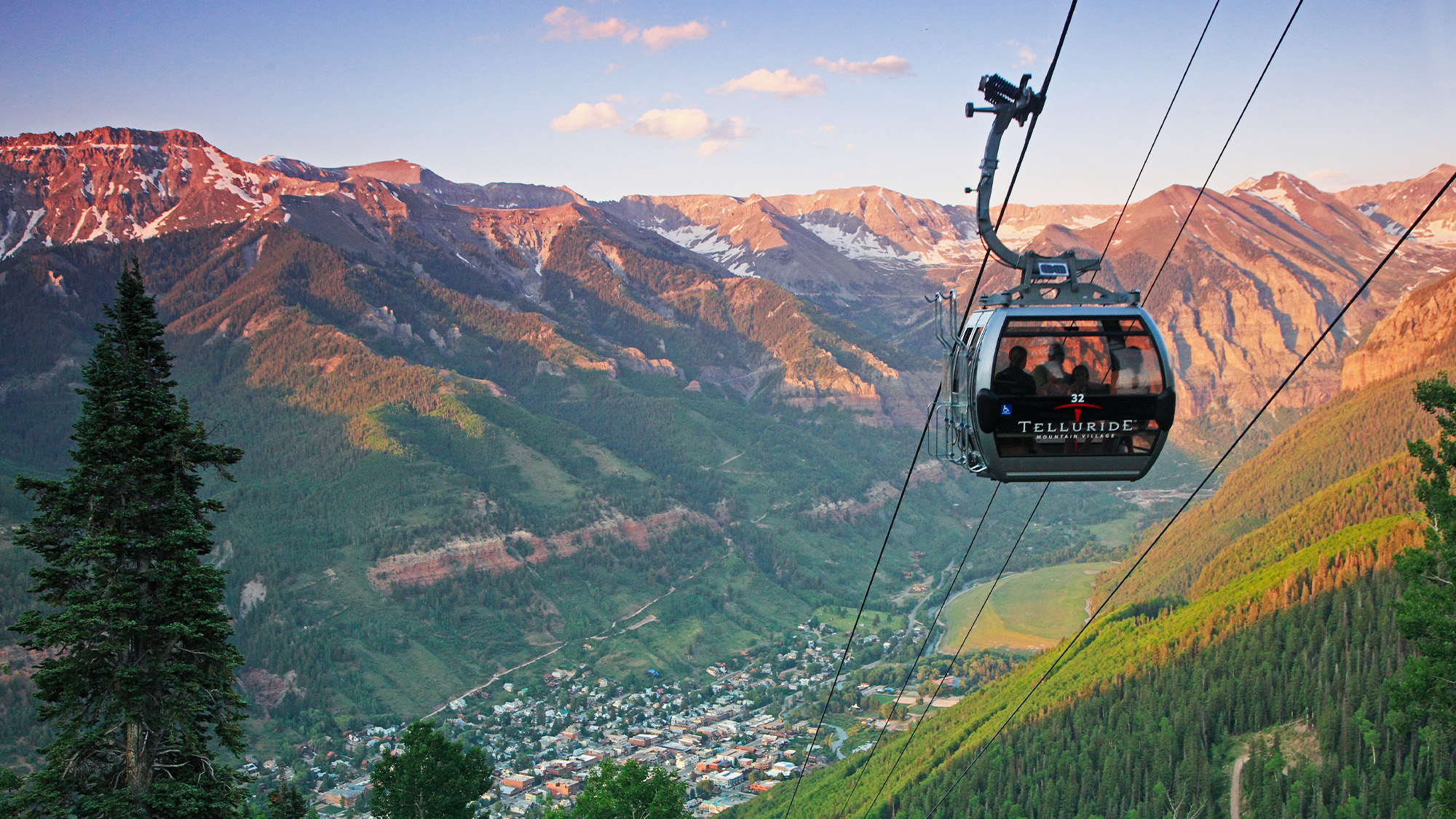Telluride Mountain Village gondola above the valley at golden hour