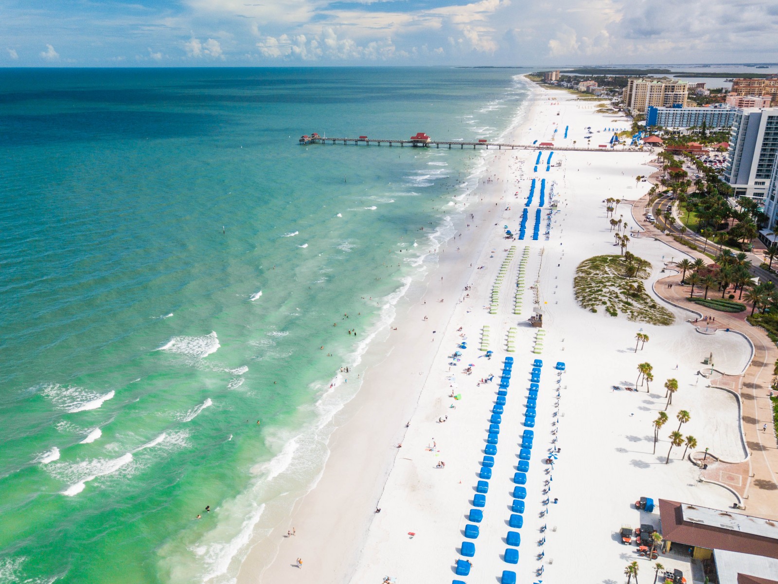 Aerial view of Clearwater Beach near Tampa with turquoise gulf water, white sand, and beachfront resorts