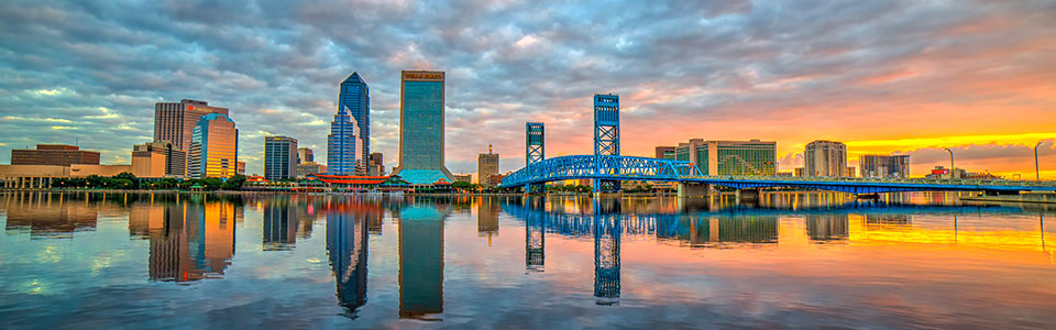 Jacksonville downtown skyline at sunset reflecting on the St. Johns River
